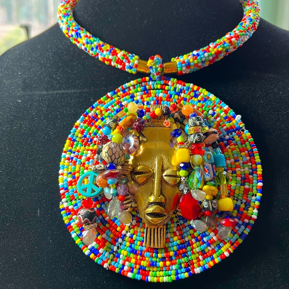 African beaded necklace with African  bronze mask. Hand made.
